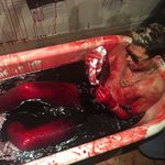 Milo Yiannopoulos bathes in pig's blood.